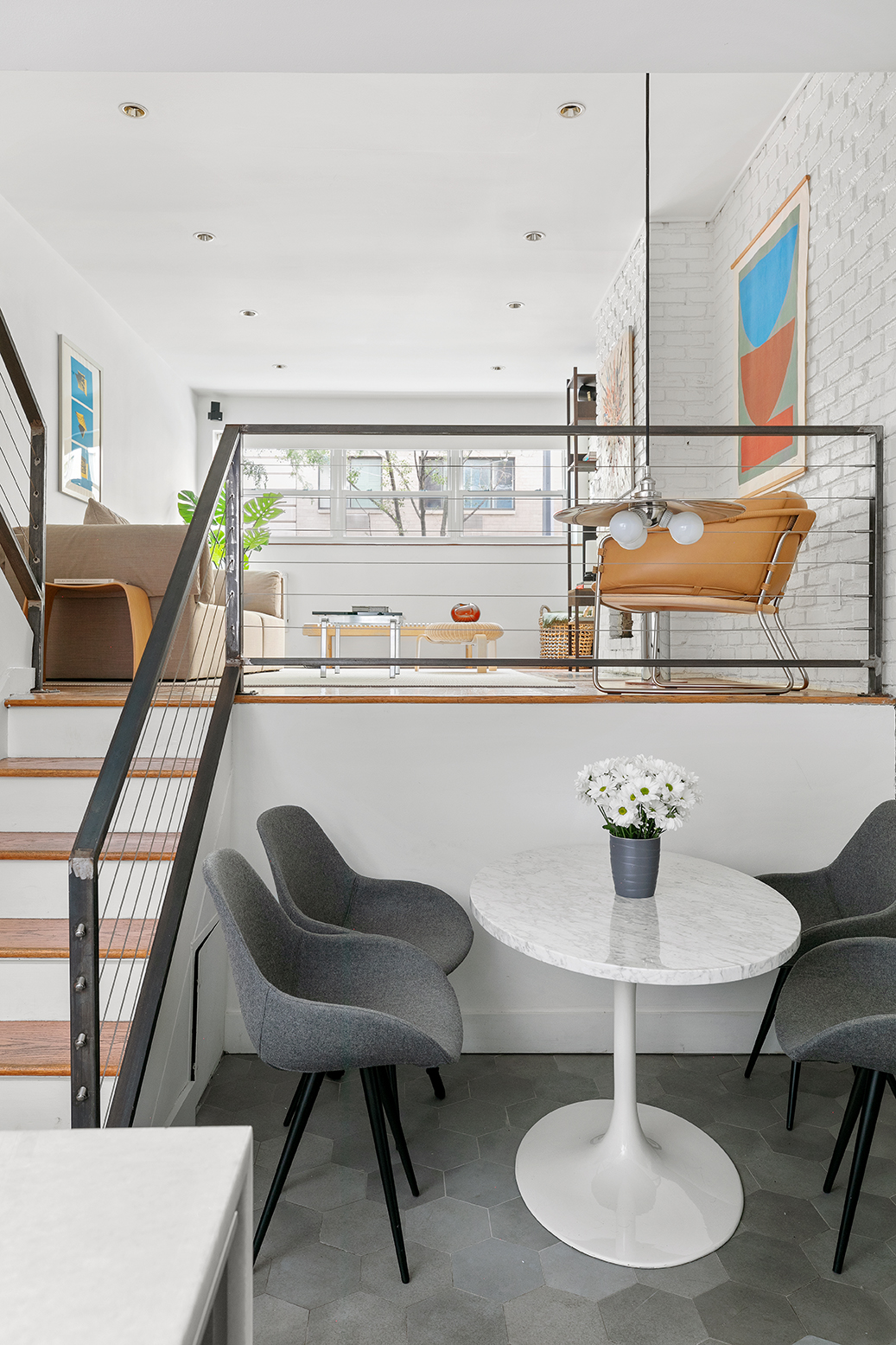 49 East 12th Street, Unit 2C Manhattan, NY 10003 - Photo 5 of 9 a living room with chairs