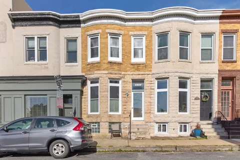 a front view of a building with parking space