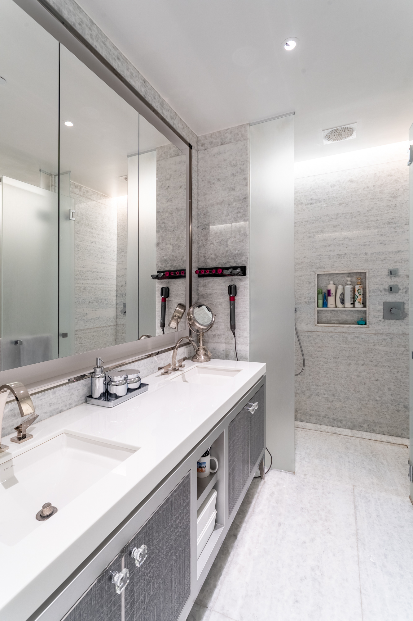 35 Hudson Yards, Unit 5903 Manhattan, NY 10001 - Photo 10 of 15 a bathroom with a sink double vanity and a mirror