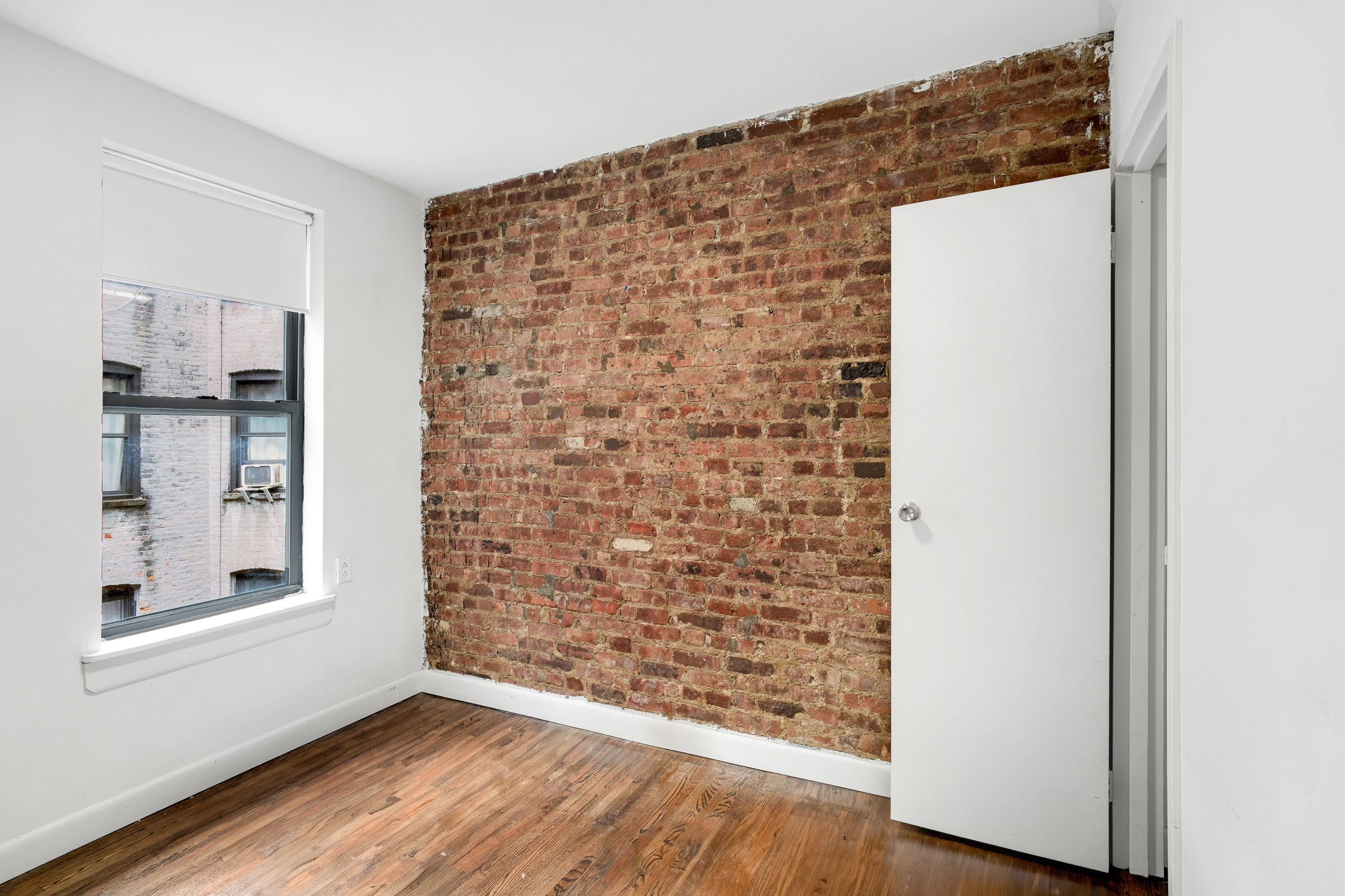 214 East 82nd Street, Unit 27 Manhattan, NY 10028 - Photo 5 of 6 a view of wooden floor