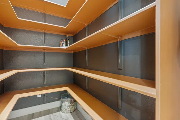 a view of wooden floor and windows in a room