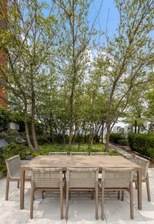 a view of building with outdoor space and sitting area
