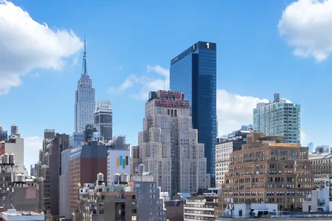 a view of city with tall buildings