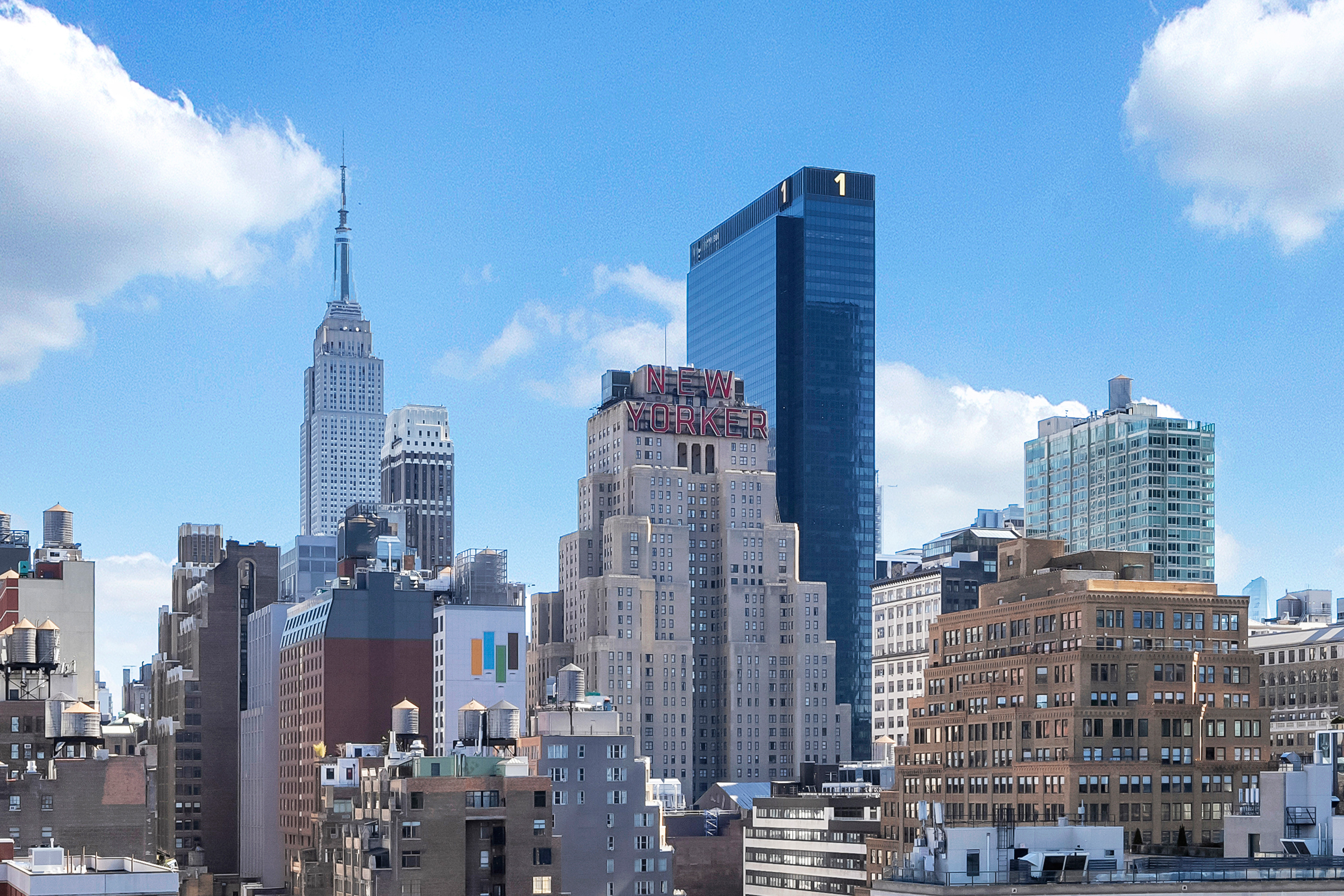 448 West 37th Street, Unit 11G/12G Manhattan, NY 10018 - Photo 3 of 17 a view of city with tall buildings