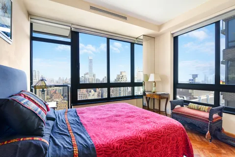 a spacious bathroom with a granite countertop sink mirror and a bathtub