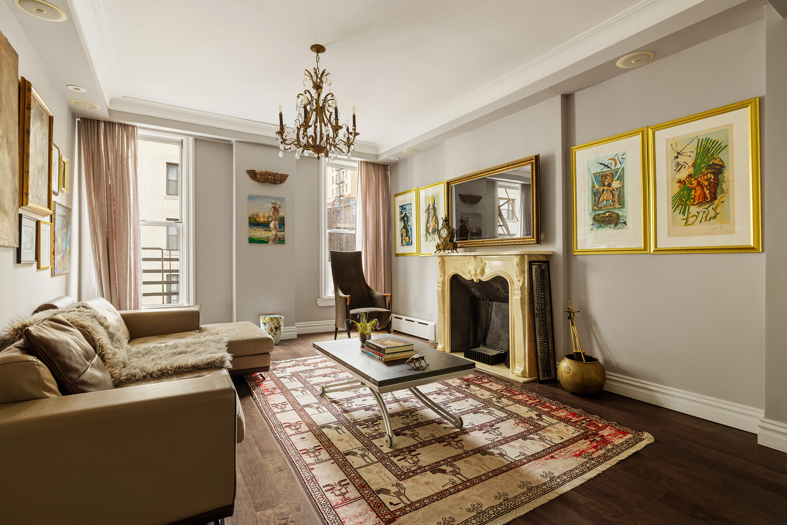 251 West 98th Street, Unit 7B Manhattan, NY 10025 - Photo 6 of 14 a living room with furniture a flat screen tv and a fireplace