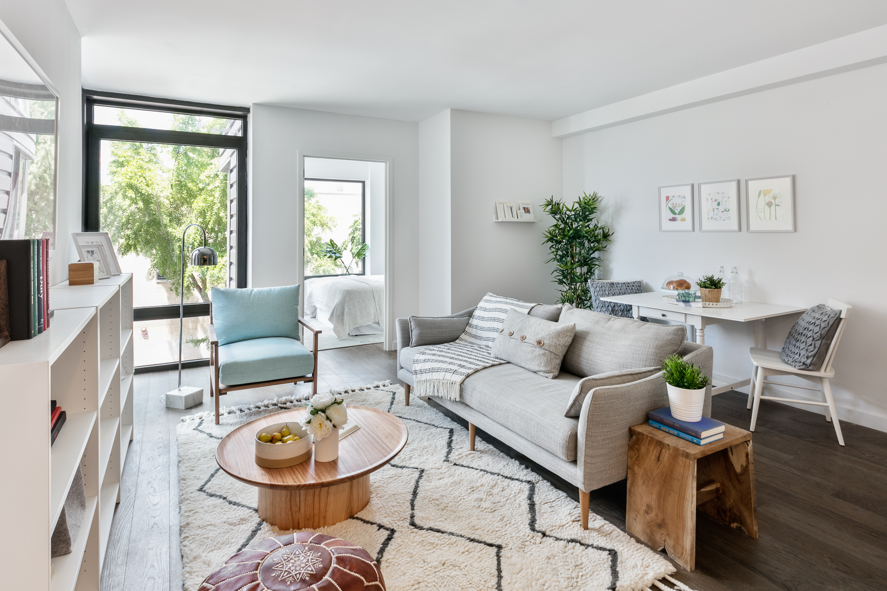 16-26 Madison Street, Unit 4I Queens, NY 11385 - Photo 2 of 18 a living room with furniture and a potted plant