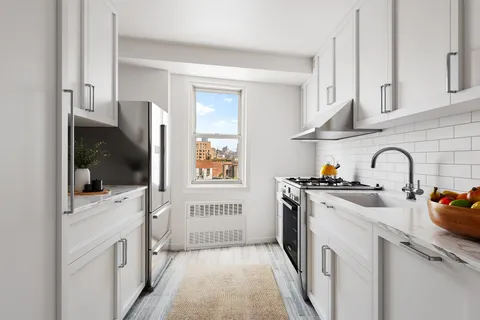 a kitchen with stainless steel appliances granite countertop a stove and a sink