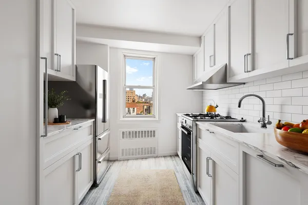 a kitchen with stainless steel appliances granite countertop a stove and a sink