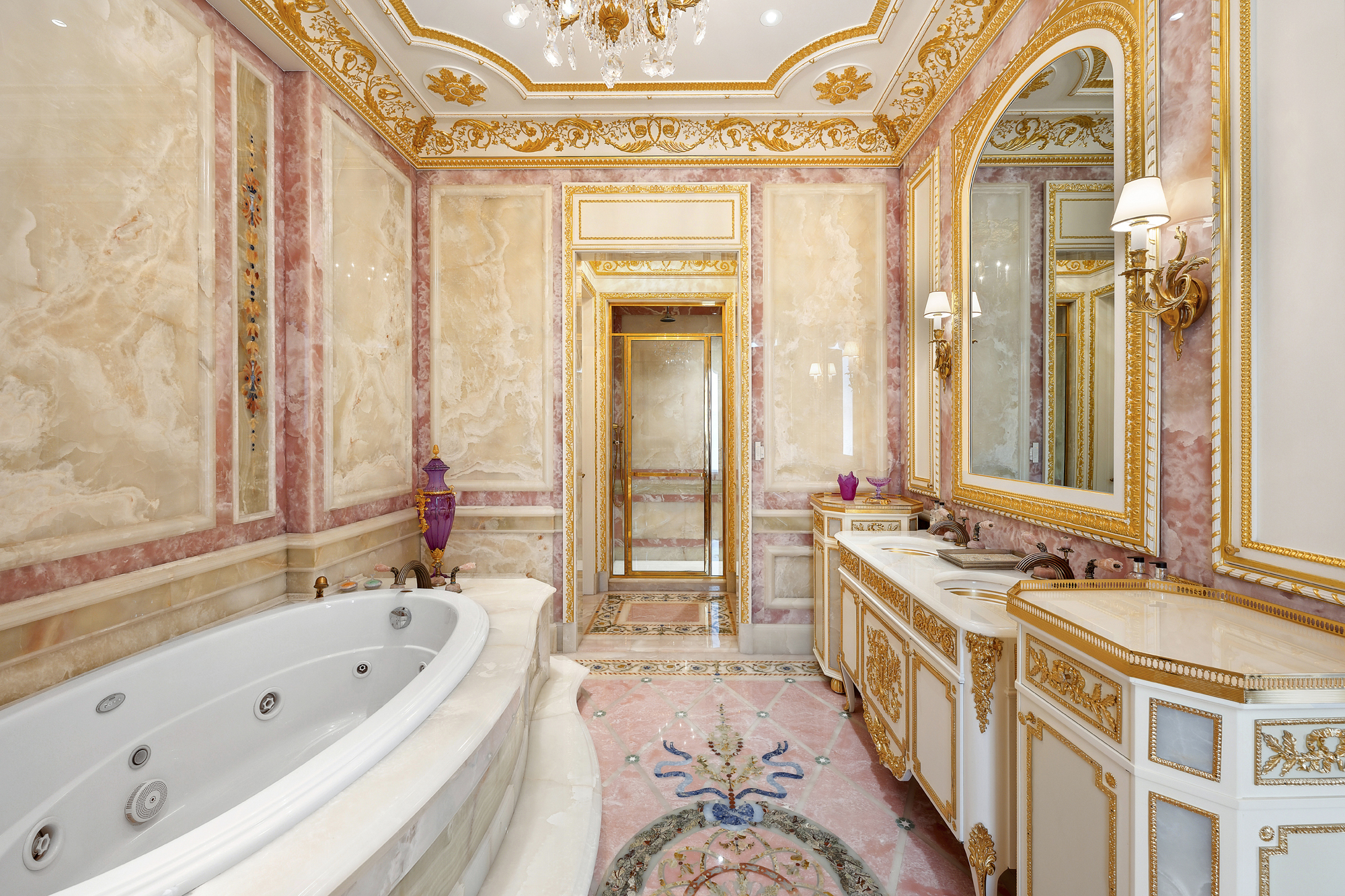 1 Central Park South, Unit 10071009 Manhattan, NY 10019 - Photo 14 of 28 a spacious bathroom with a tub a double vanity sink a mirror and a bathtub next to a window