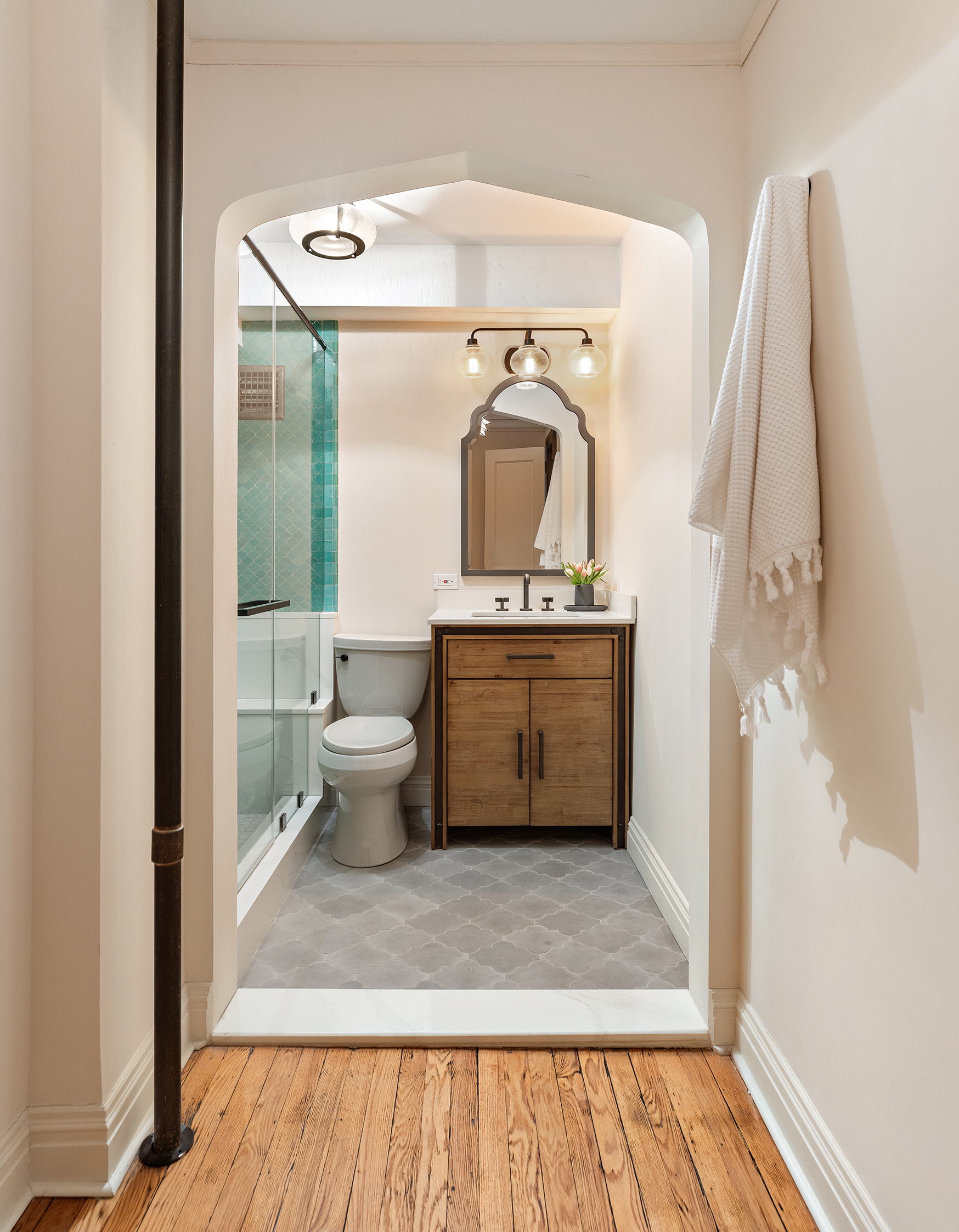 200 East 16th Street, Unit 5LM Manhattan, NY 10003 - Photo 5 of 16 a view of bathroom with a toilet sink and a mirror