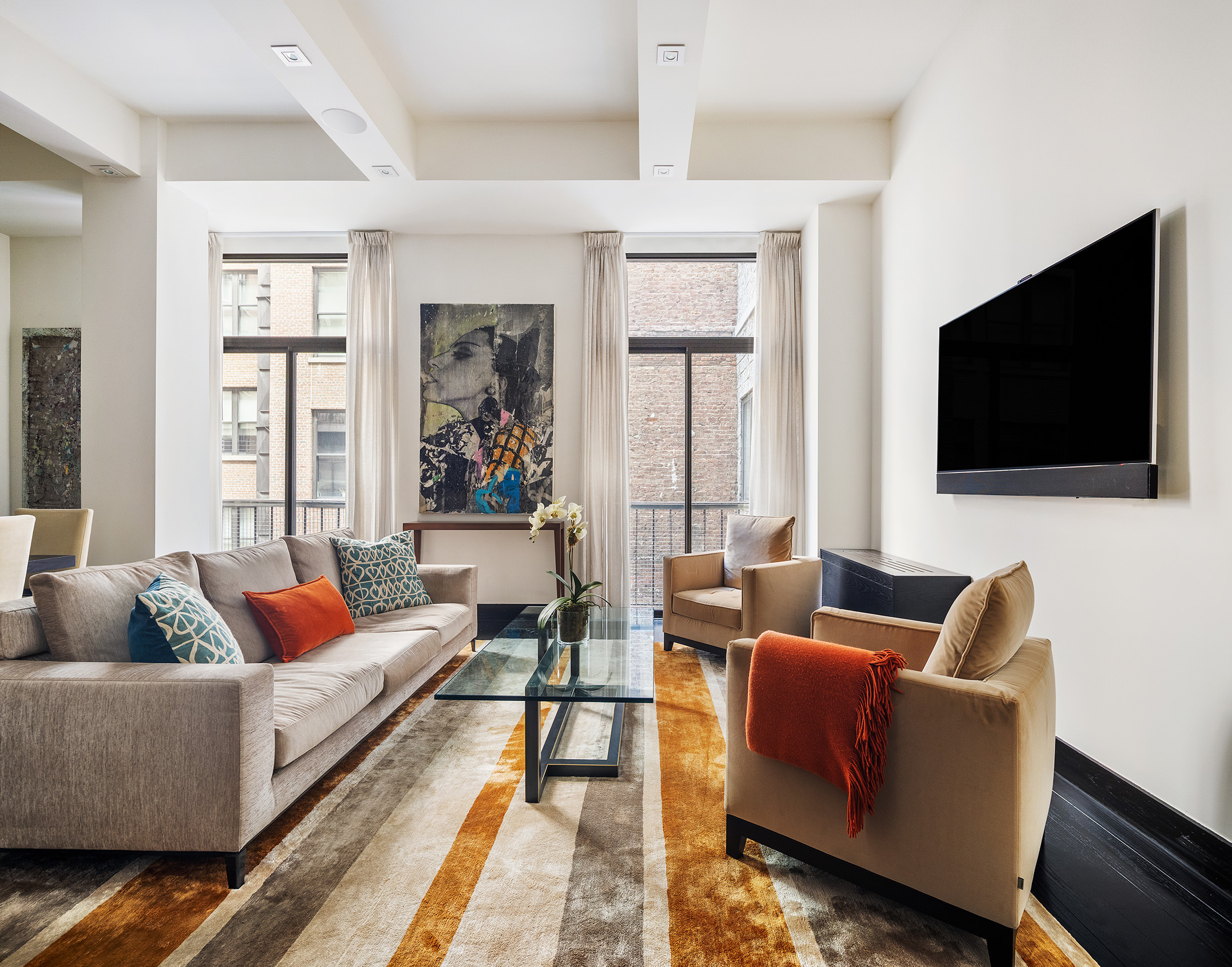 Park Ave S, Unit 7PR Manhattan, NY 10010 - Photo 5 of 15 a living room with furniture and a flat screen tv