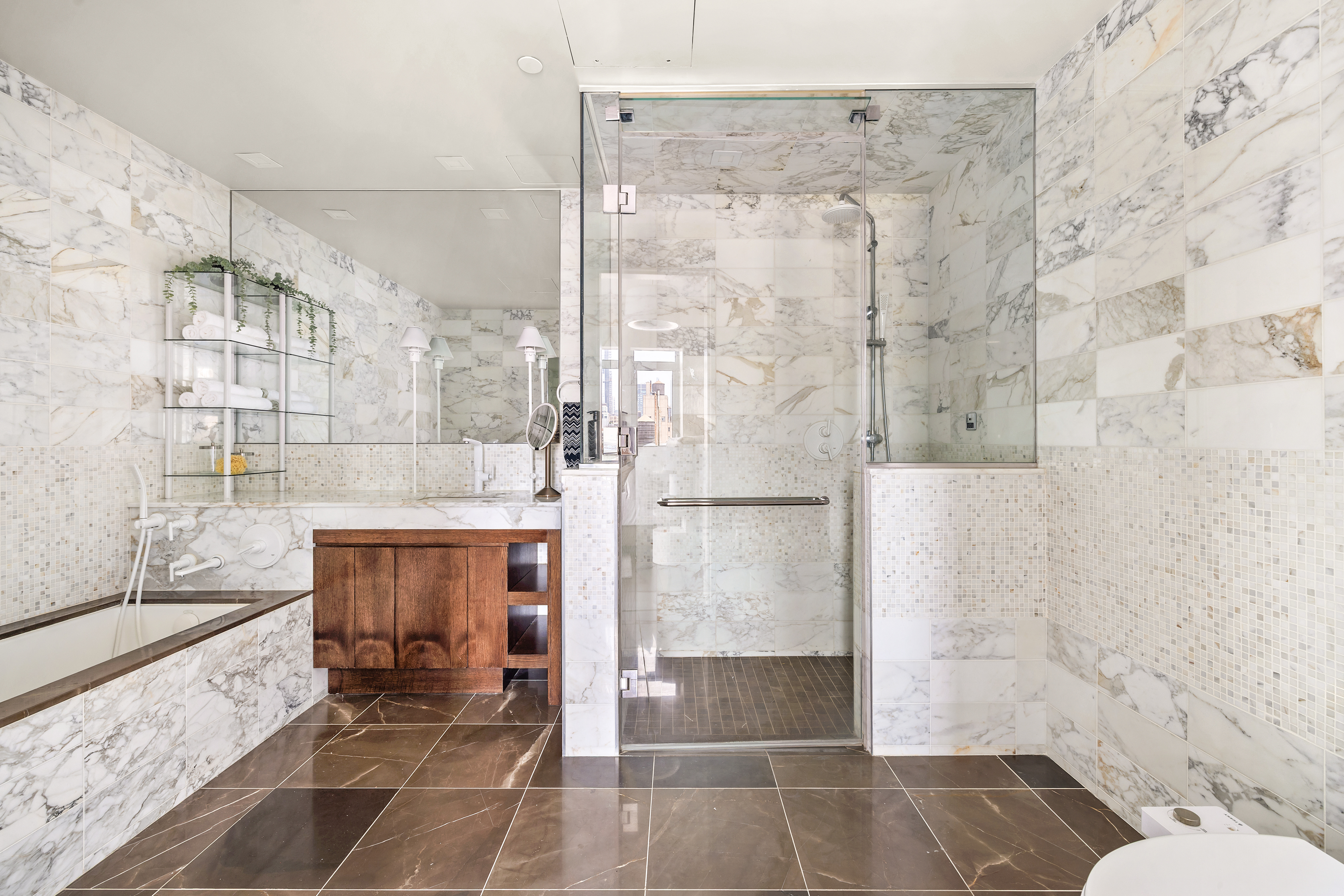 35 West 15th Street, Unit 14D Manhattan, NY 10011 - Photo 6 of 18 a bathroom with a glass shower door