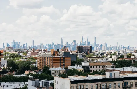 a view of a city with tall buildings