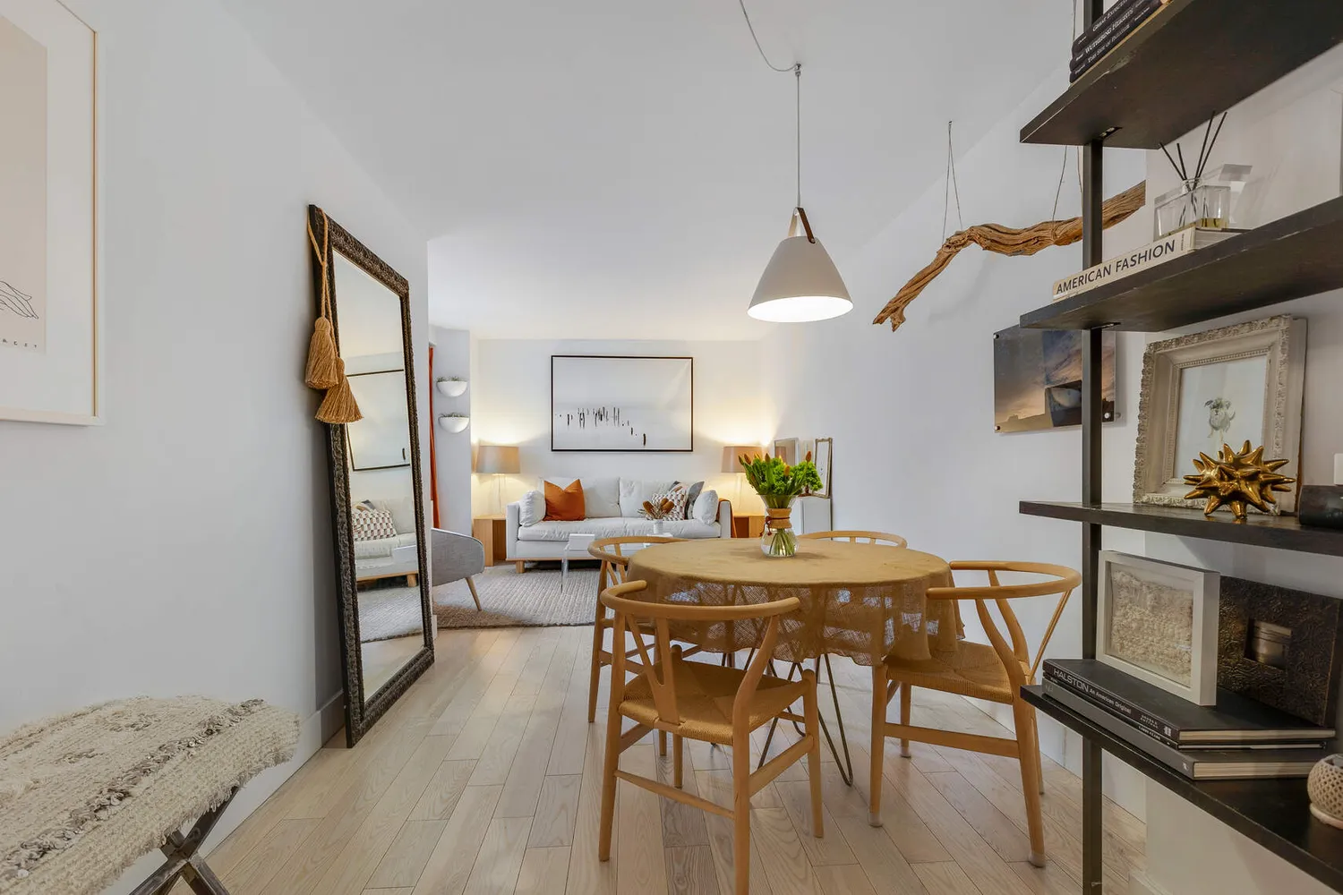 a view of a dining room with furniture and wooden floor