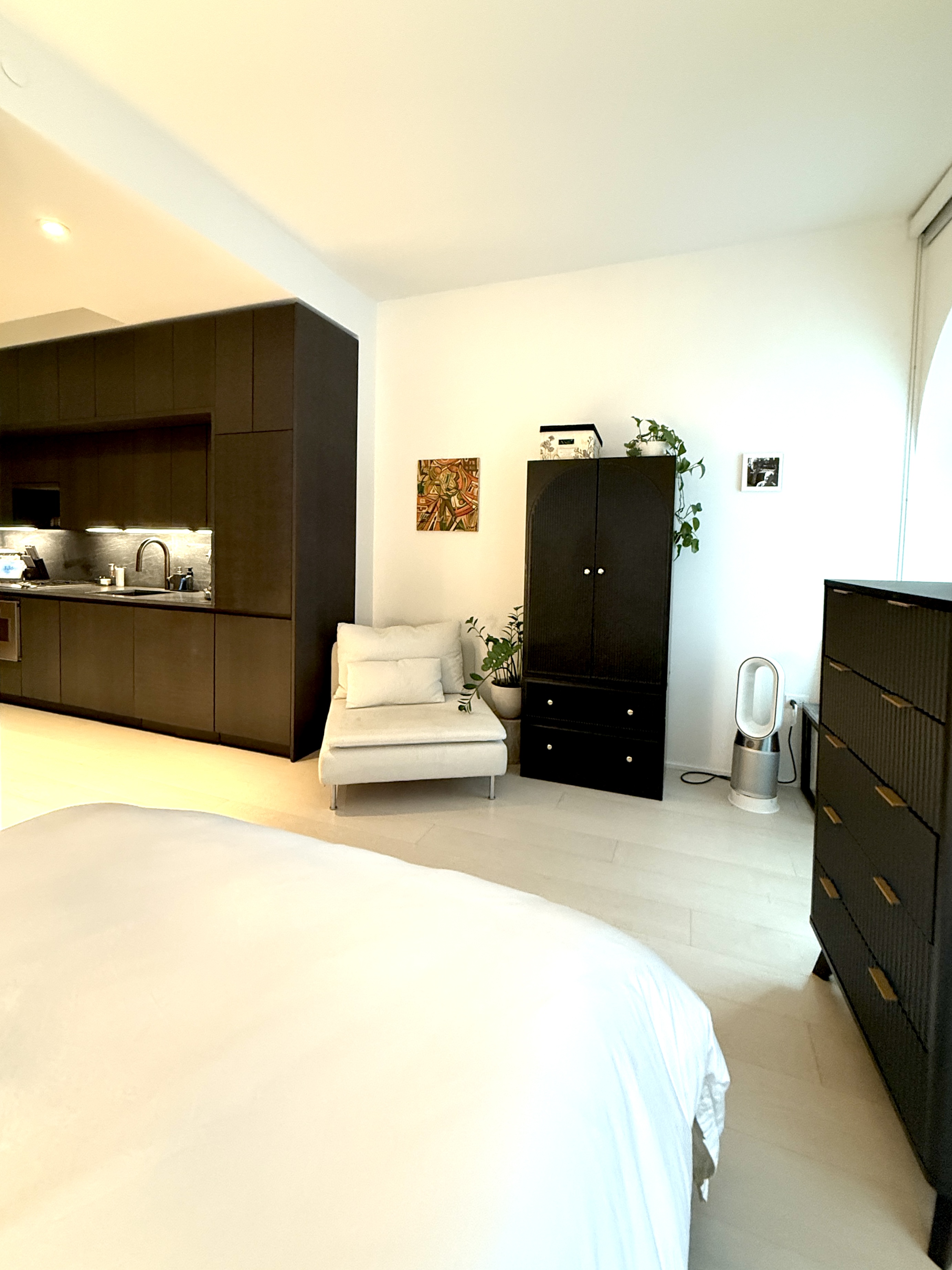 130 William Street, Unit 9E Manhattan, NY 10038 - Photo 9 of 16 a bedroom with a bed and flat screen tv