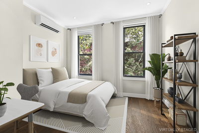 106 Bedford Avenue, Unit 3L Brooklyn, NY 11249 - Photo 4 of 7 a bedroom with a bed and a window