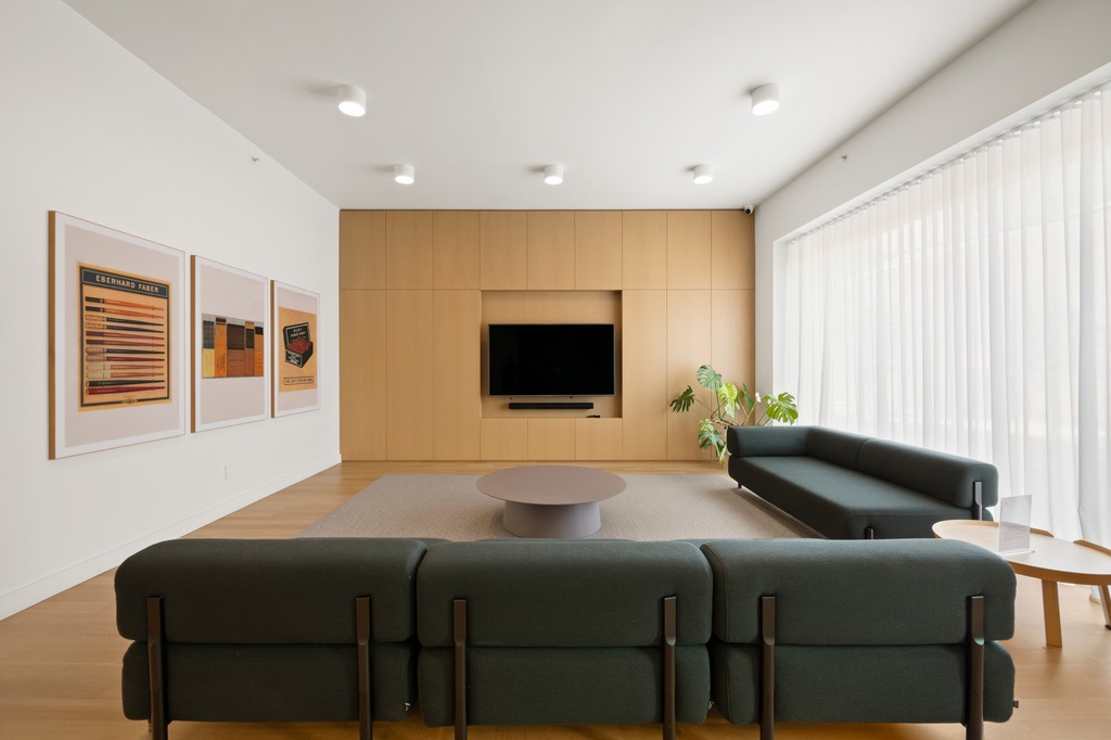 122 West Street, Unit PHA Brooklyn, NY 11222 - Photo 12 of 14 a bedroom with a bed and a flat screen tv