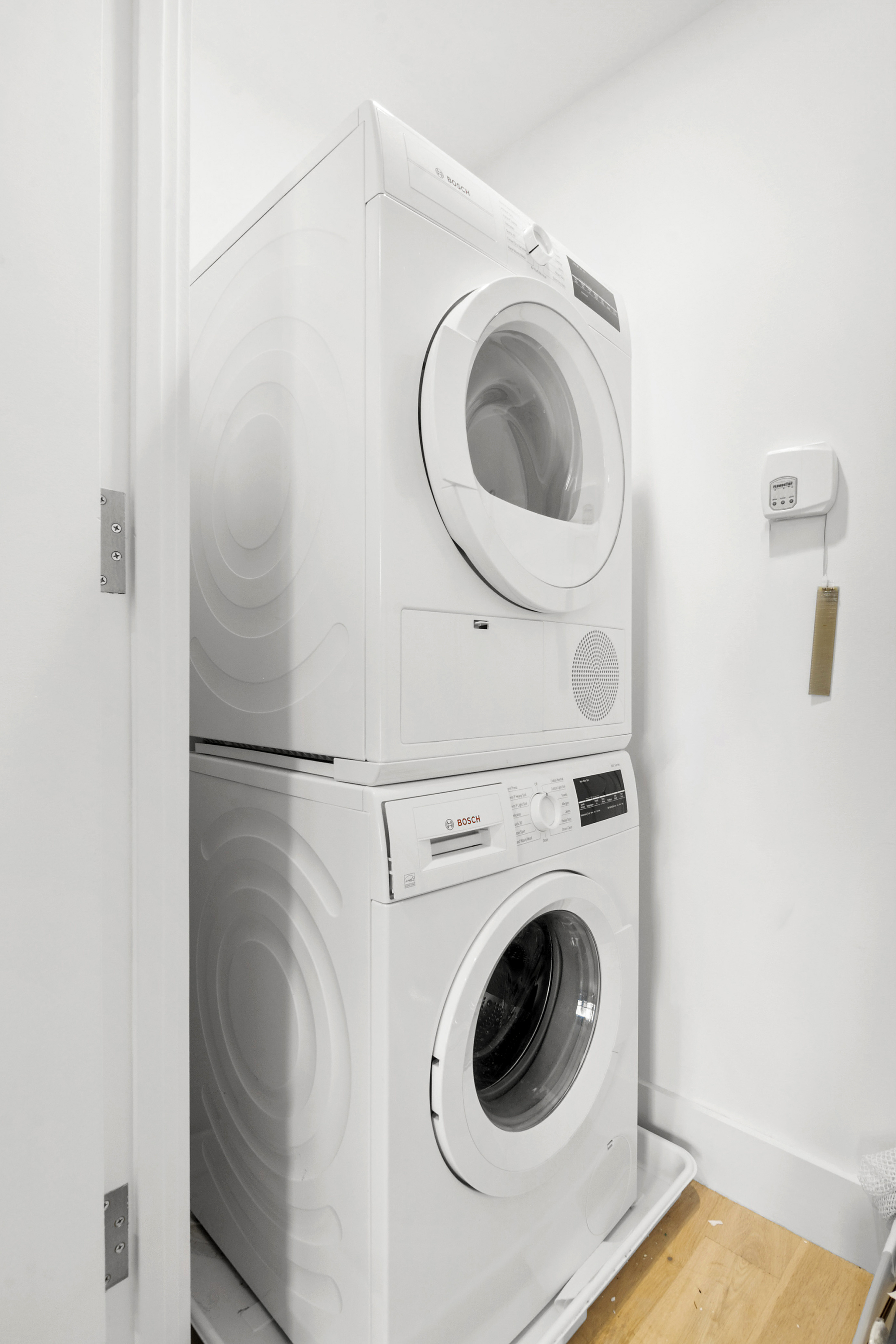 111 Montgomery Street, Unit 7C Brooklyn, NY 11225 - Photo 4 of 15 a utility room with dryer and washer