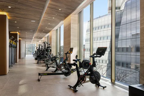 a view of a room with wooden floor and windows