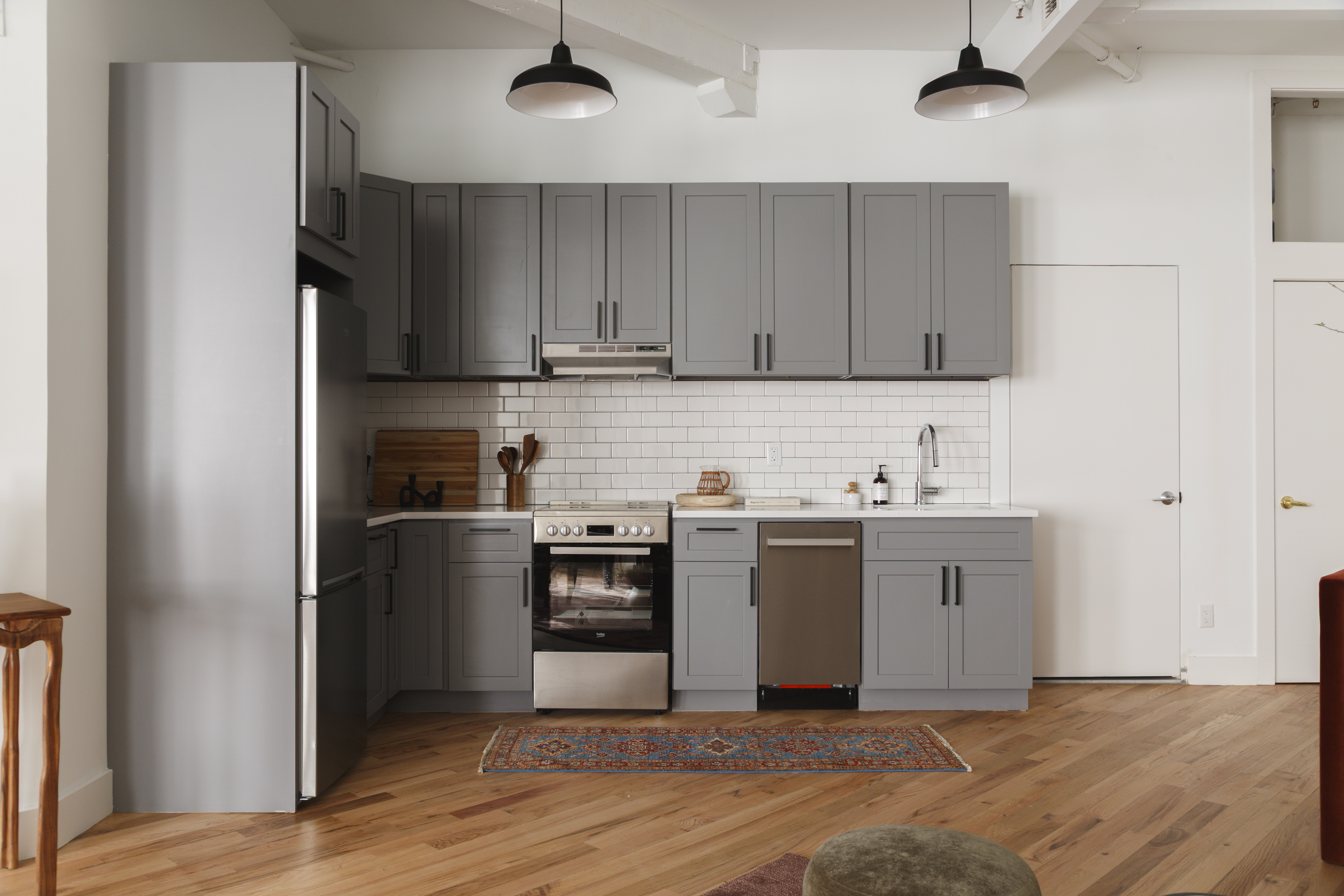 239 Banker Street, Unit 2G Brooklyn, NY 11222 - Photo 10 of 13 a kitchen with stainless steel appliances granite countertop a refrigerator and a stove top oven