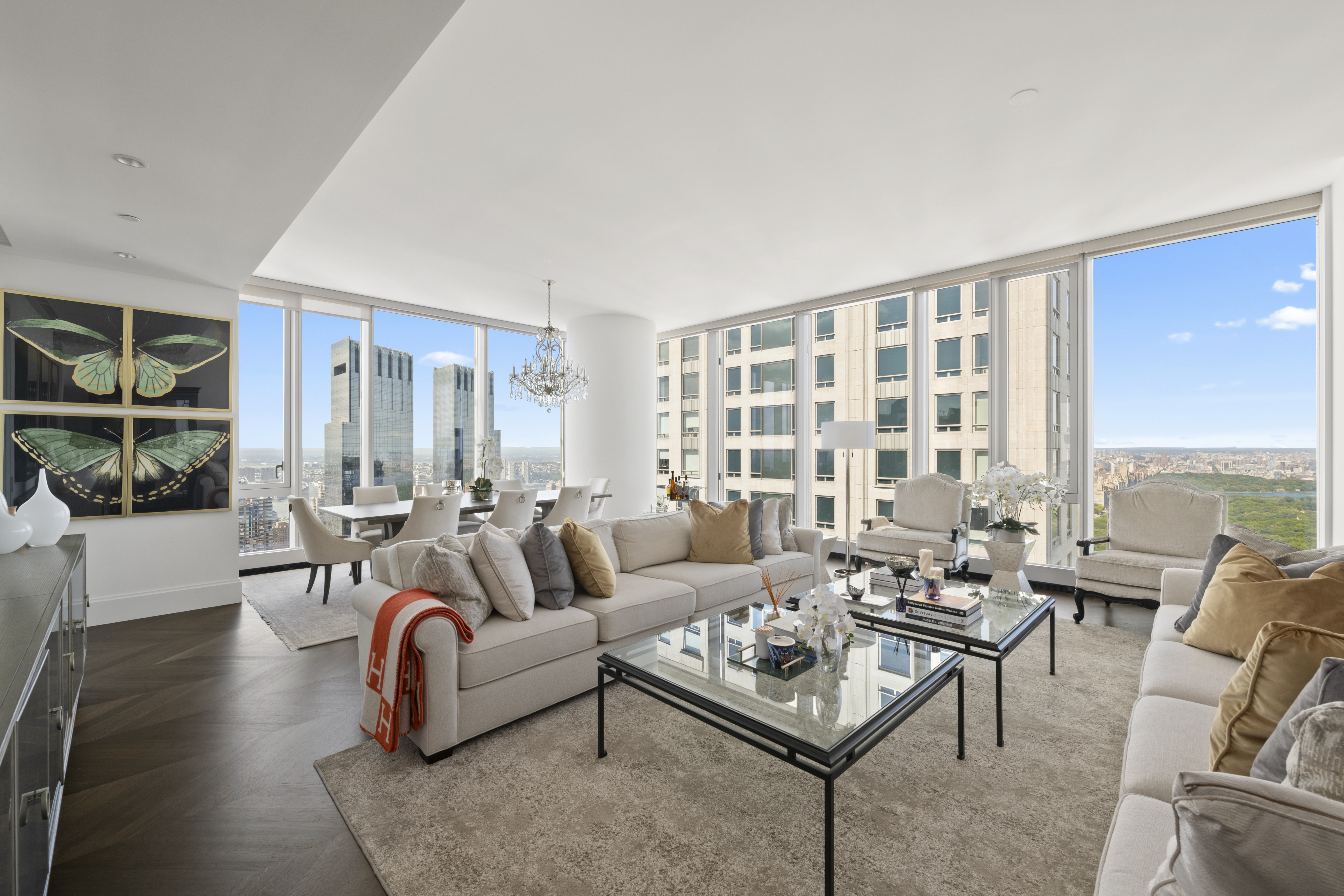 217 West 57th Street, Unit 58W Manhattan, NY 10019 - Photo 2 of 30 a living room with furniture and a large window