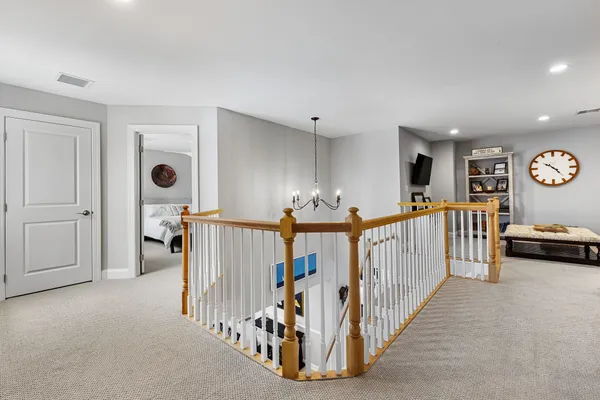 a view of a livingroom with furniture and staircase