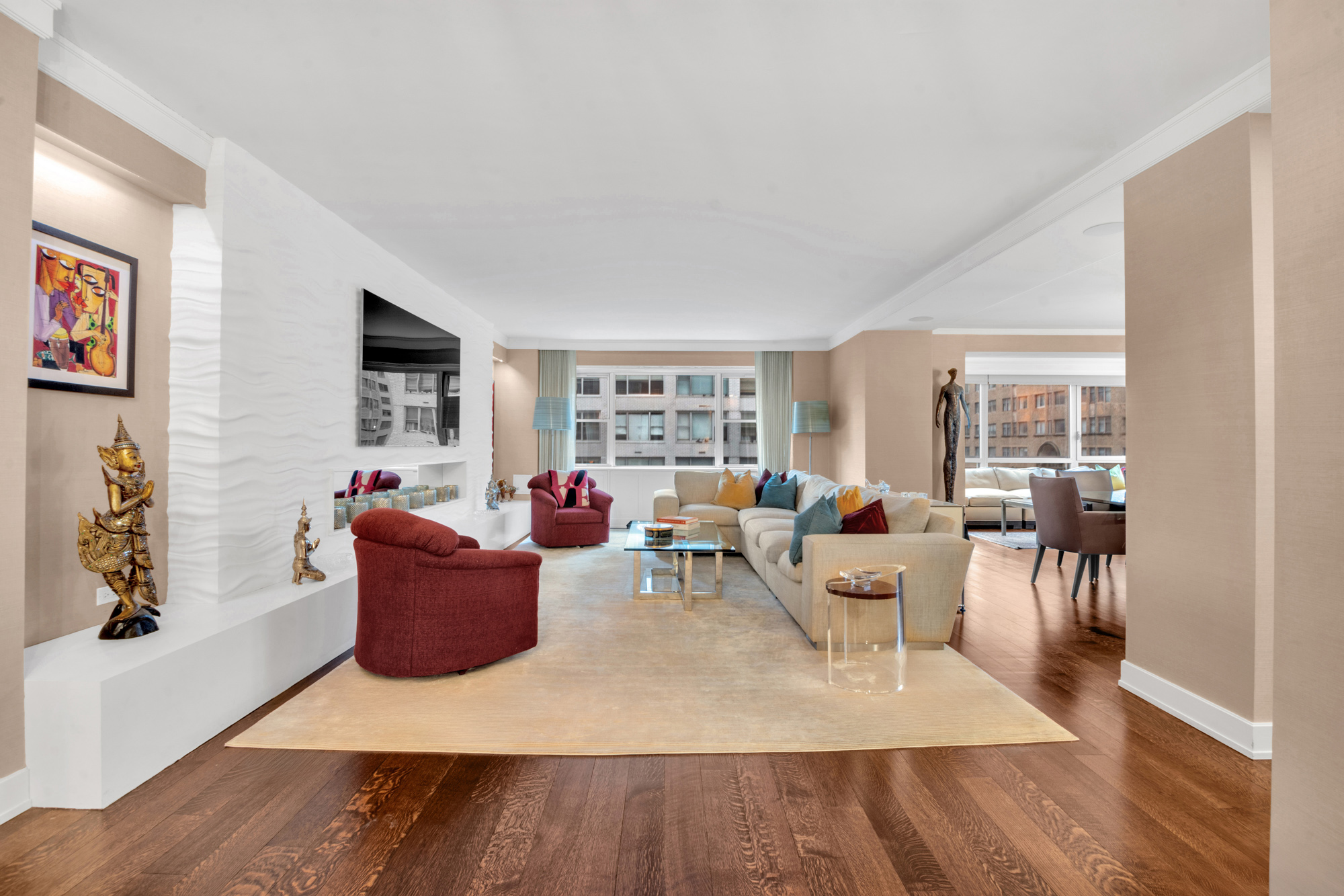 150 East 69th Street, Unit 6Q Manhattan, NY 10021 - Photo 1 of 15 a living room with furniture and a wooden floor
