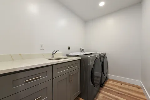 a view of empty room with wooden floor and closet