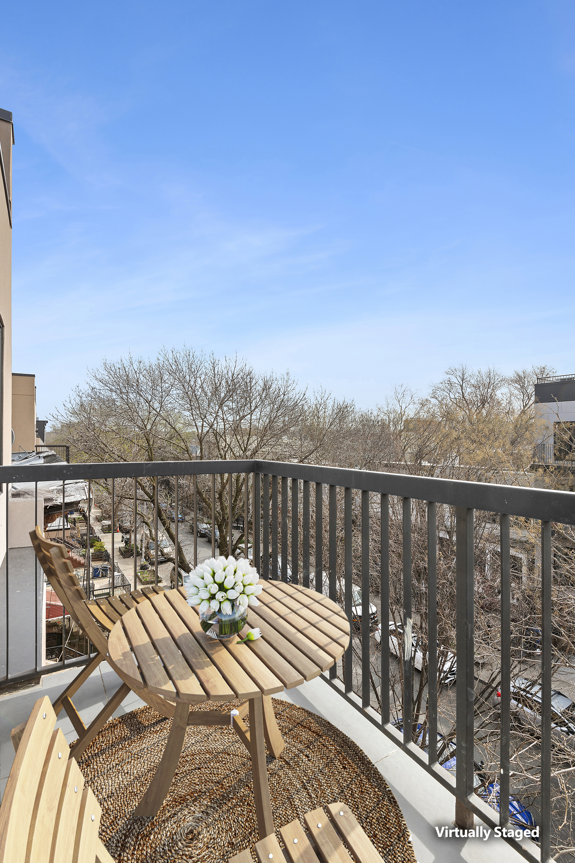 111 Woodbine Street, Unit 4 Brooklyn, NY 11221 - Photo 5 of 7 a view of a balcony with wooden chairs