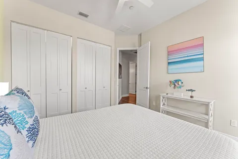 a large kitchen with a refrigerator a sink dishwasher a stove and a refrigerator with wooden floor