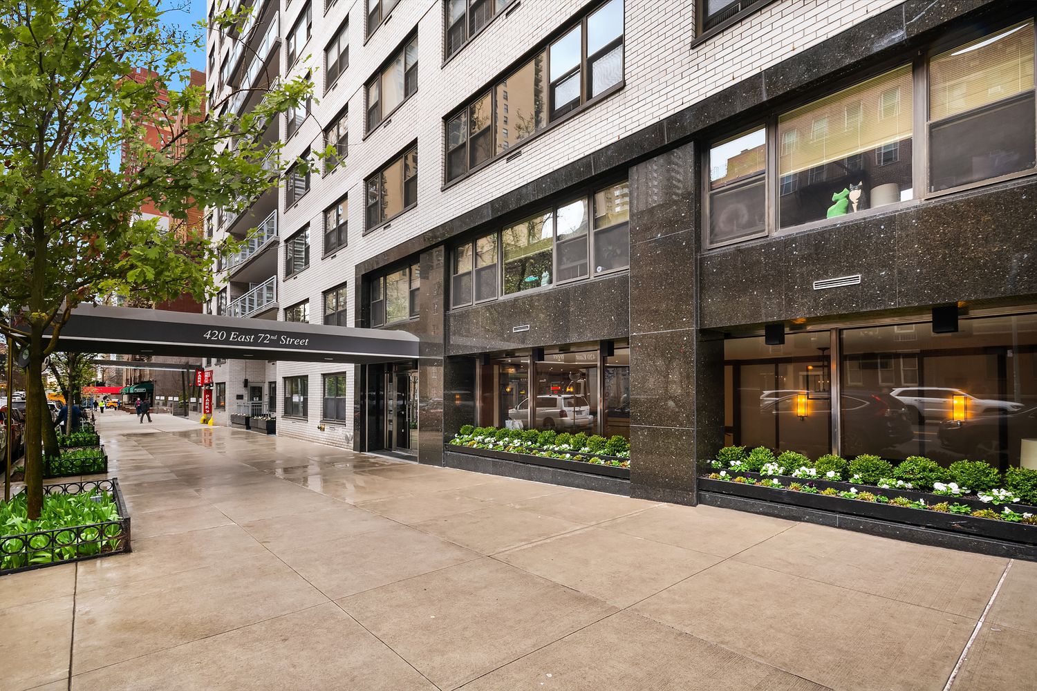 420 East 72nd Street, Unit 7L Manhattan, NY 10021 - Photo 9 of 10 a view of a building with a street