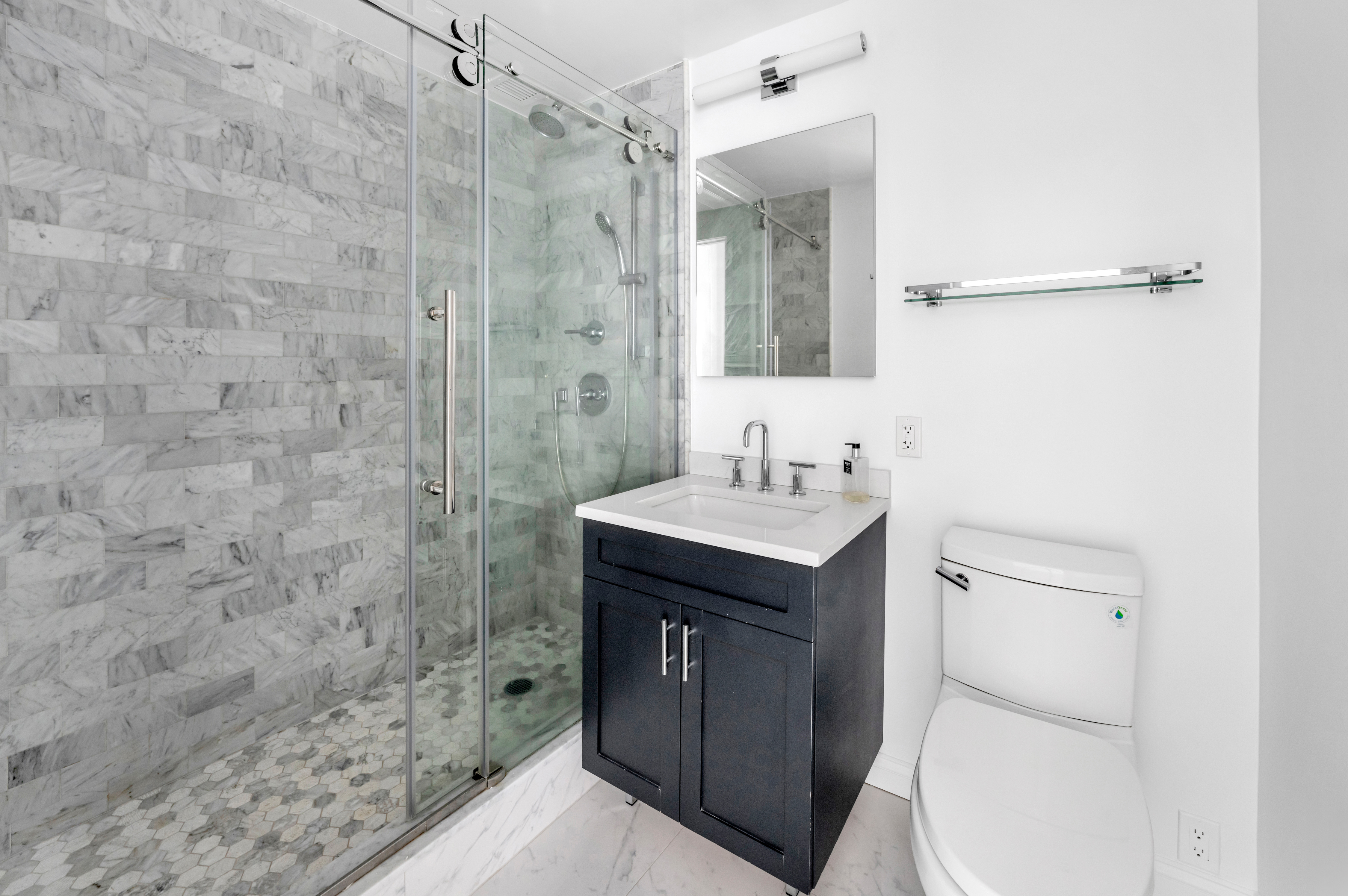 110 West 90th Street, Unit 5C Manhattan, NY 10024 - Photo 13 of 15 a bathroom with a sink a toilet and shower