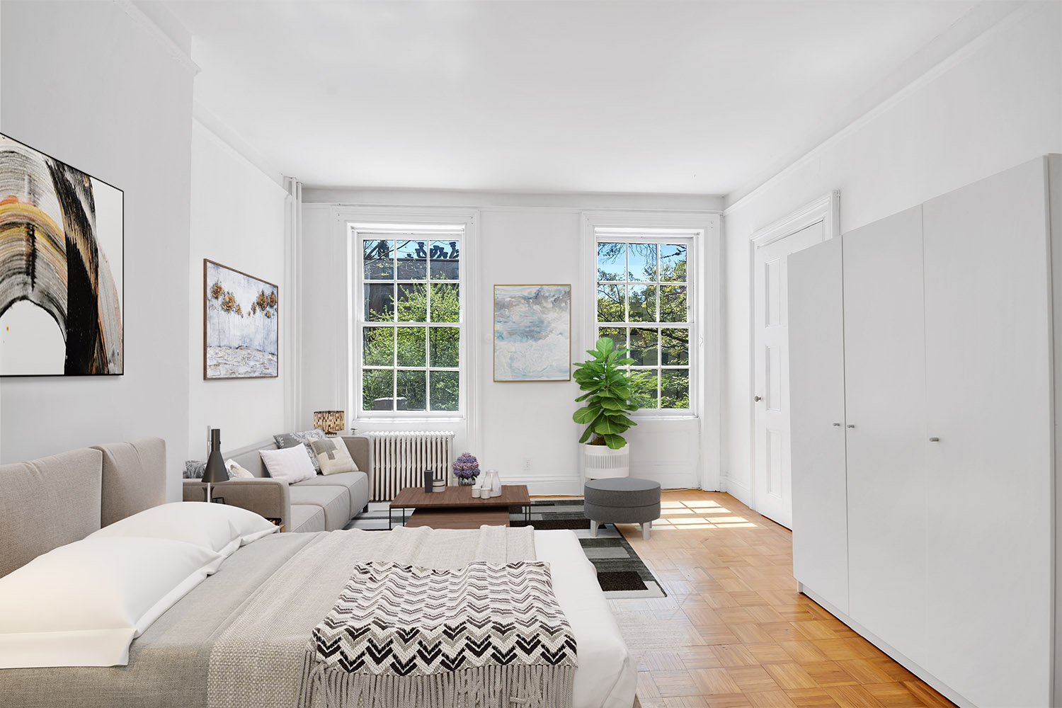 a bedroom with a bed and wooden floor