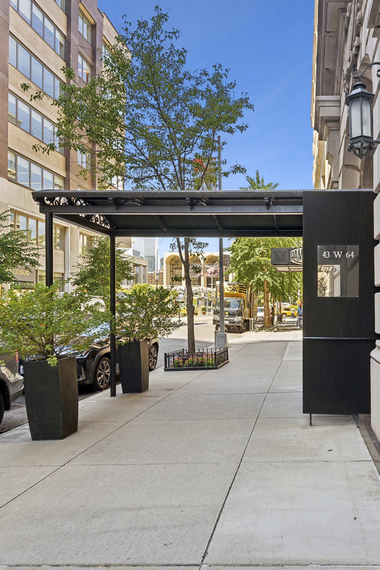 43 West 64th Street, Unit 4D Manhattan, NY 10023 - Photo 9 of 11 a lobby with a bench and potted plants