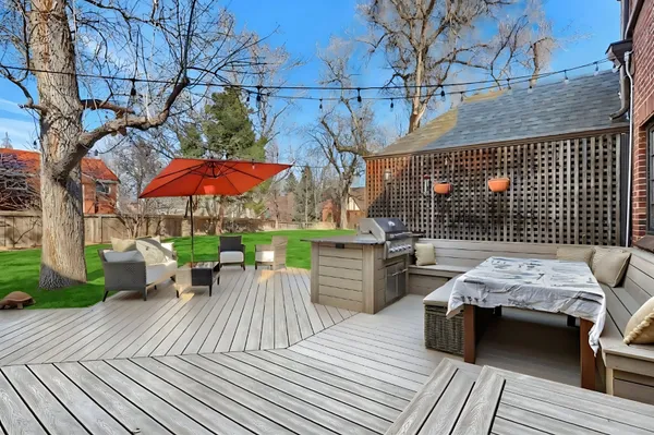 a view of a patio with a table and chairs
