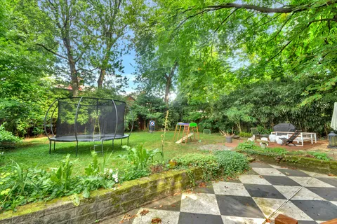 a backyard of a house with lots of green space