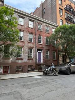 a view of a street with cars