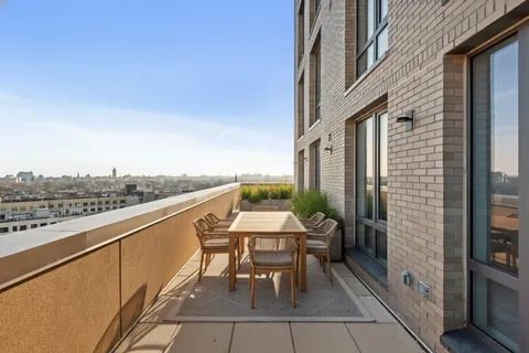 a view of balcony with furniture