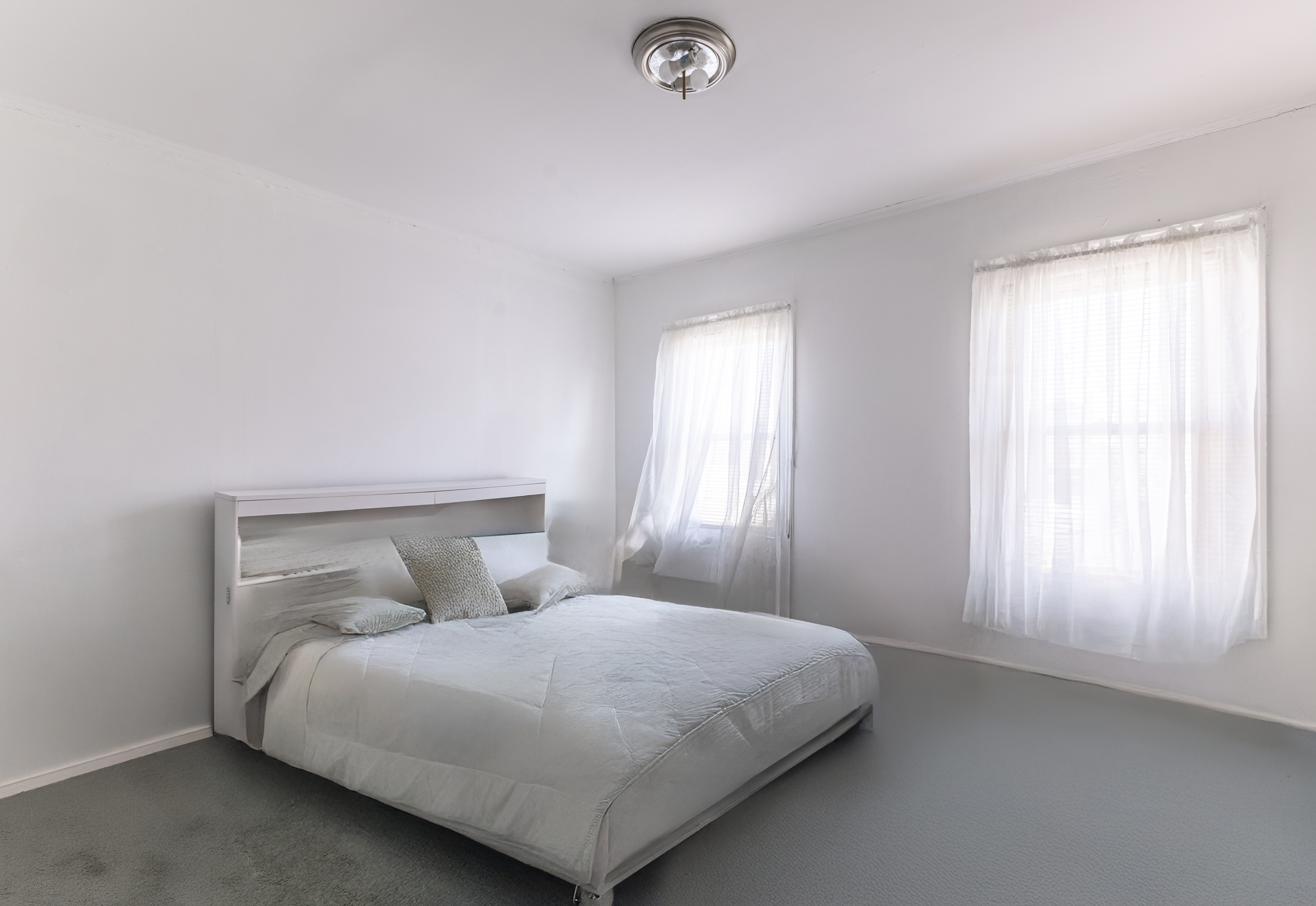 961 East 32nd Street Brooklyn, NY 11210 - Photo 10 of 25 a bedroom with a bed and a window