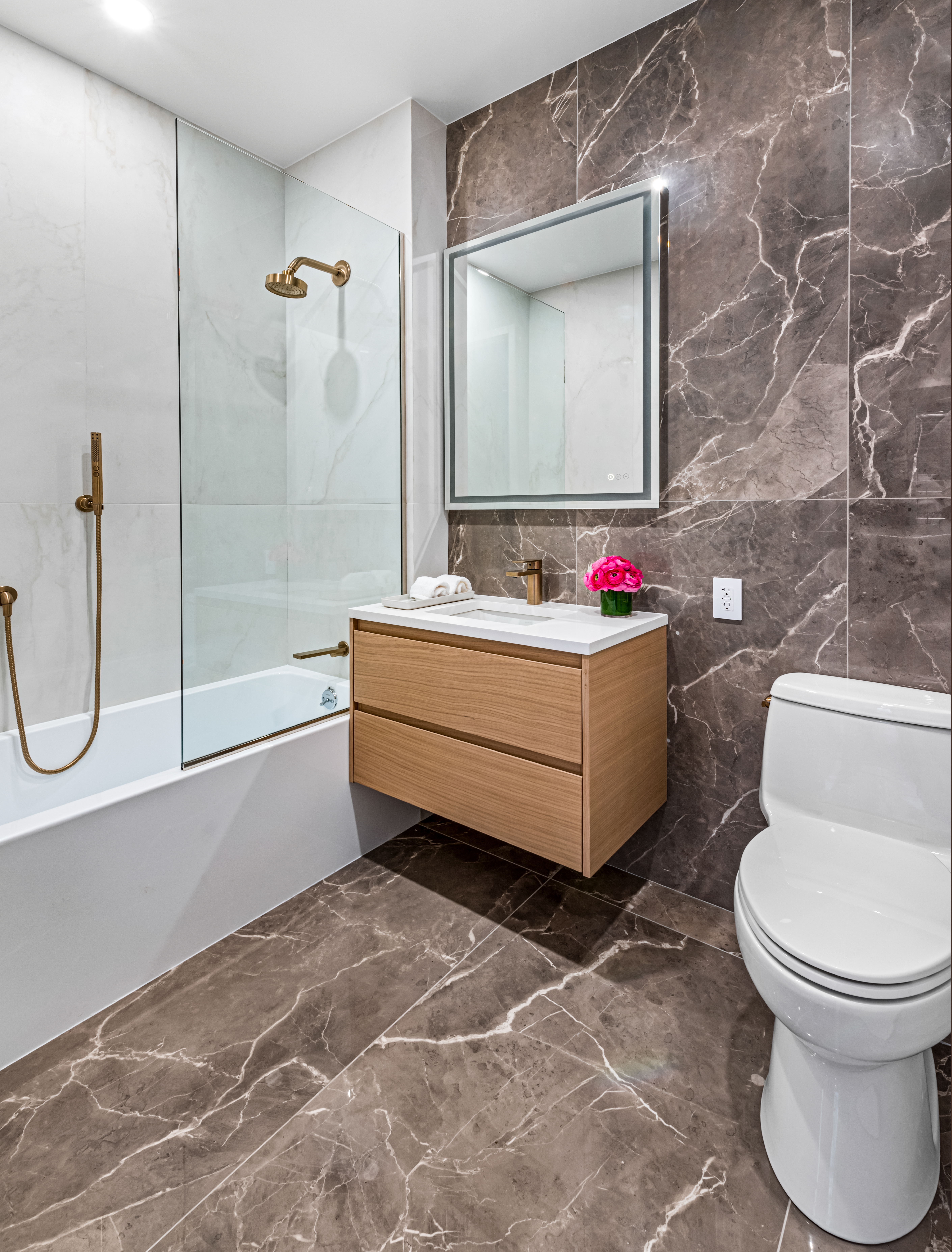 420 East 75th Street, Unit 6 Manhattan, NY 10021 - Photo 10 of 25 a bathroom with a toilet sink and shower