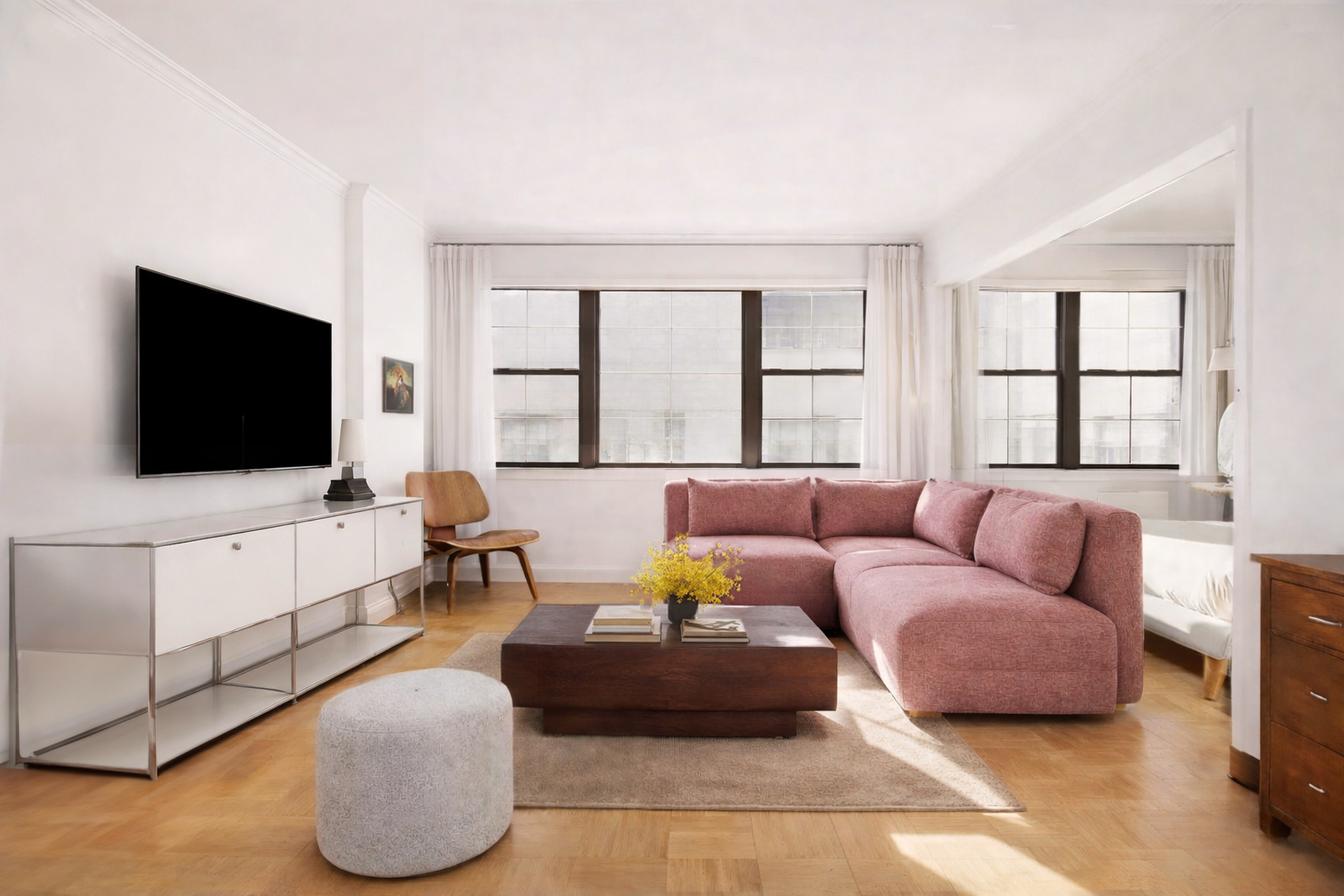 a living room with furniture and a flat screen tv