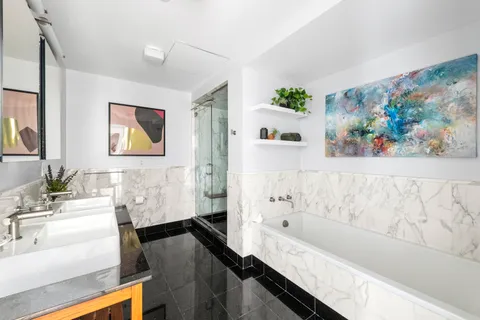 a bathroom with a bathtub and a sink