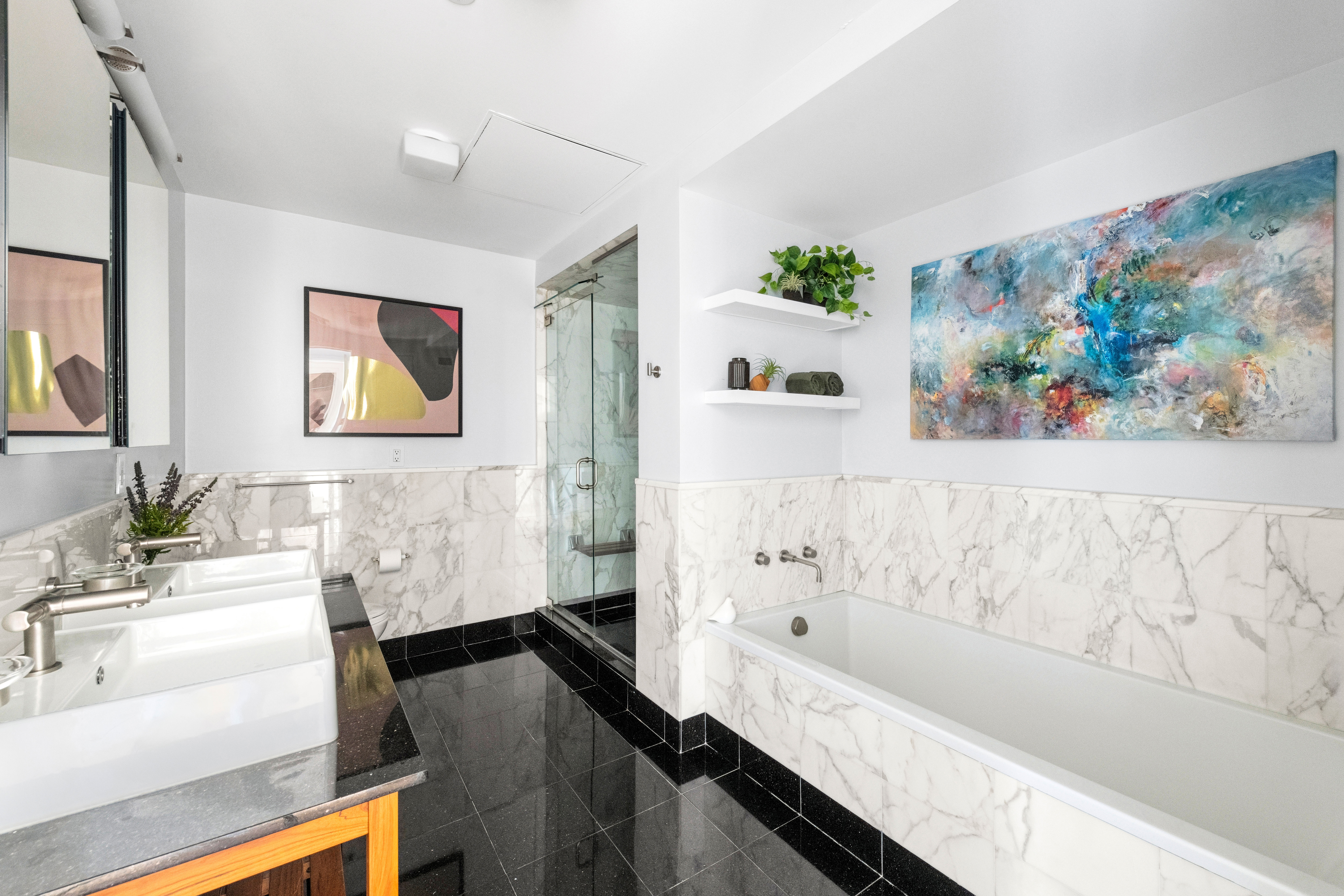 146-148 West 22nd Street, Unit PH Manhattan, NY 10011 - Photo 7 of 13 a bathroom with a bathtub and a sink