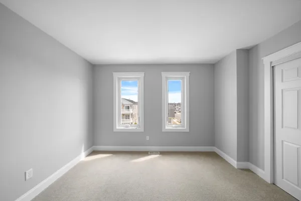 a view of a balcony with a couches and wooden floor