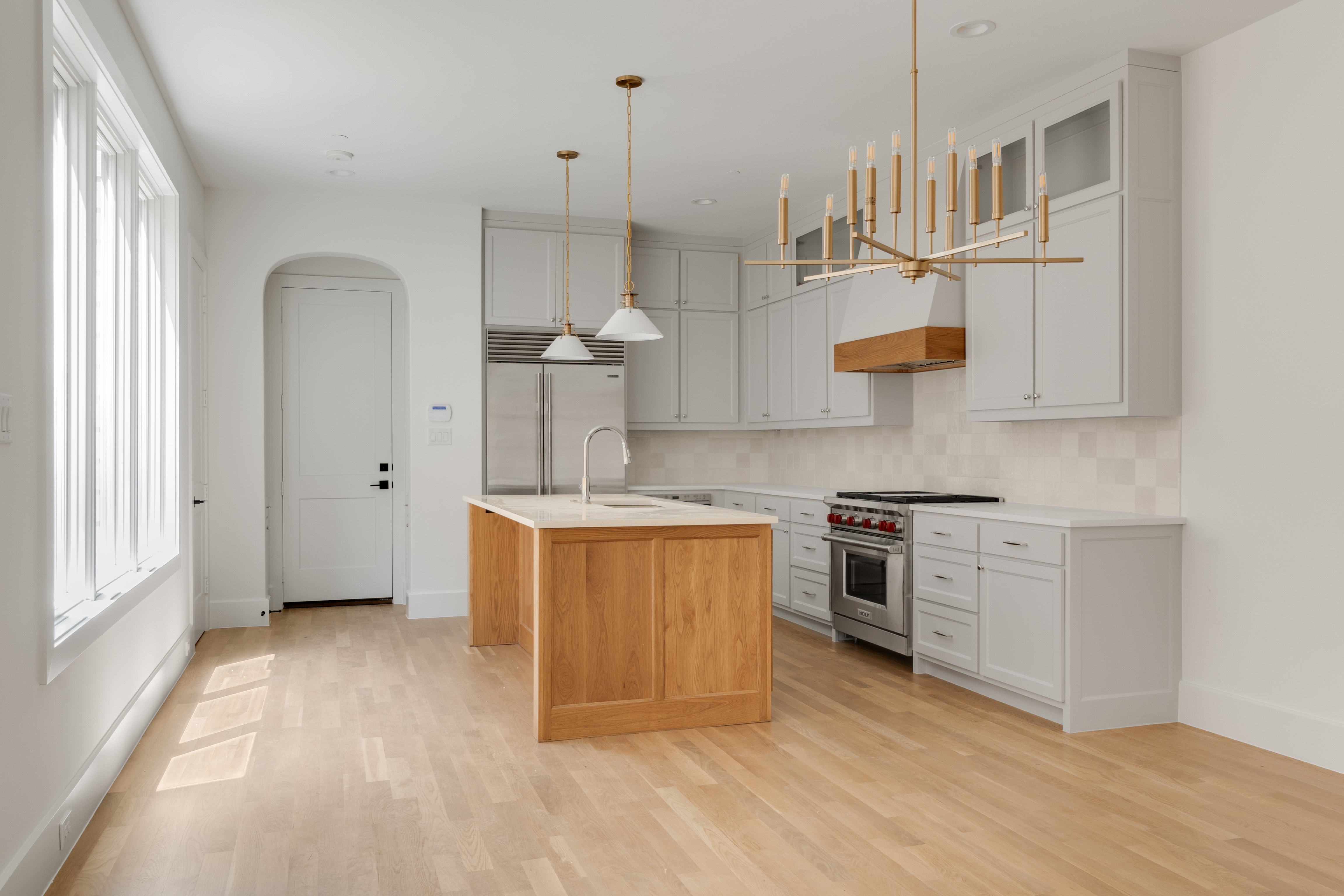 4410 Glenwick Lane Dallas, TX 75205 - Photo 18 of 28 a kitchen with stainless steel appliances granite countertop a stove a sink and a refrigerator