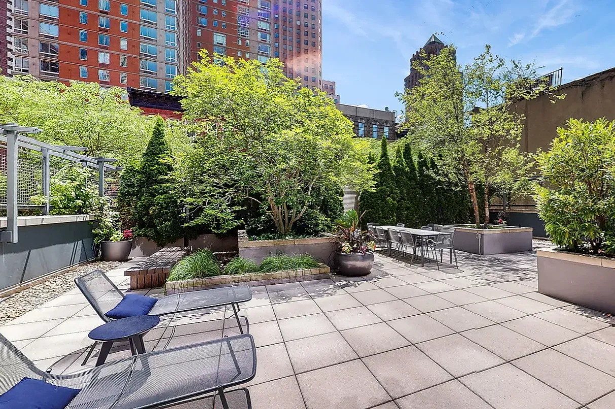 a view of a terrace with furniture and potted plants