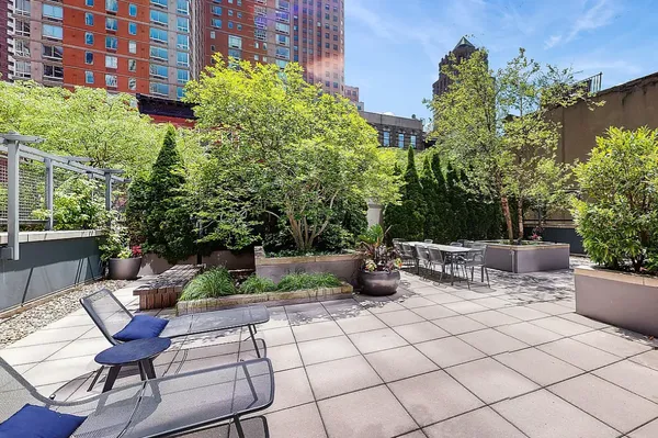 a view of a terrace with furniture and potted plants