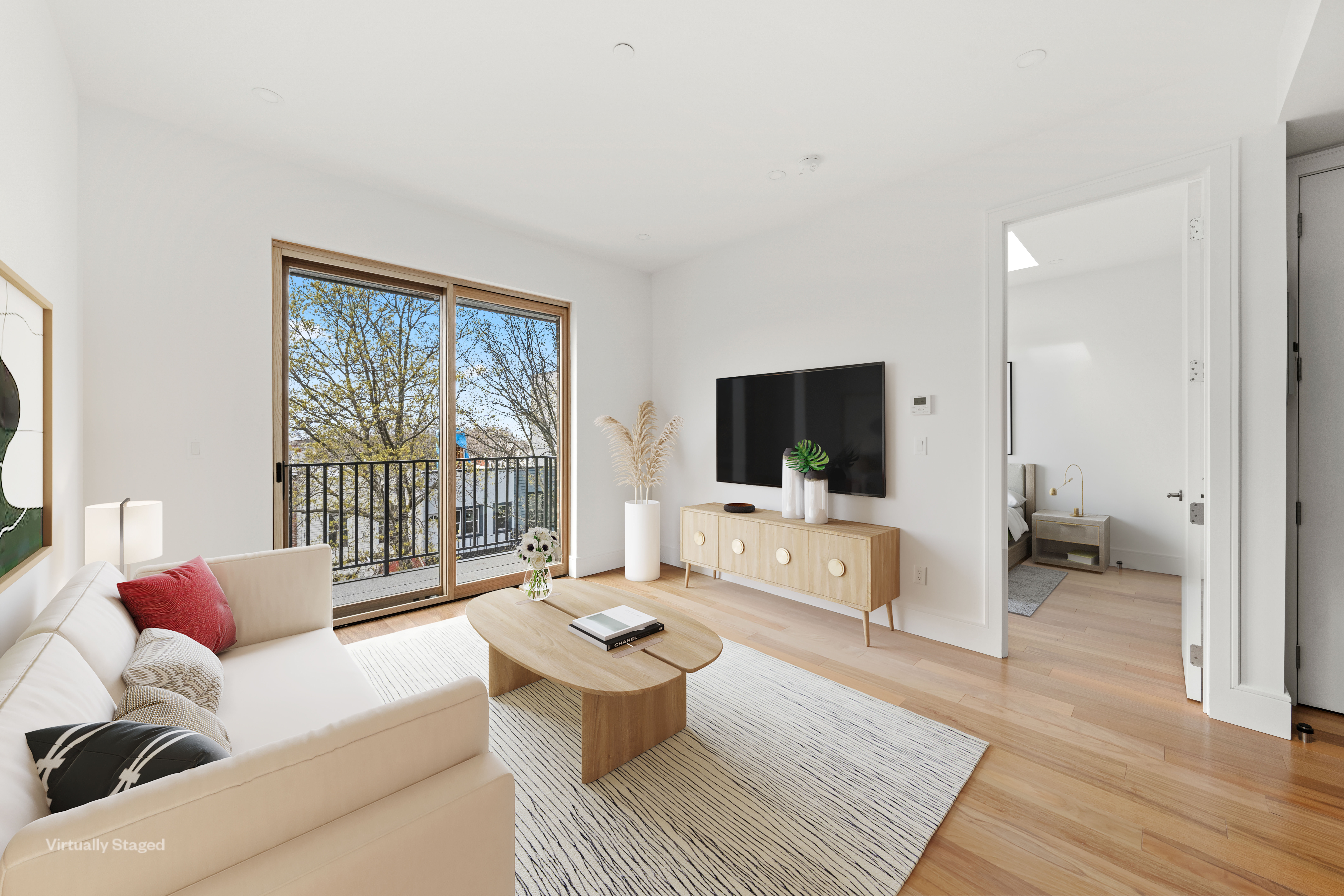 a living room with furniture a flat screen tv and a large window
