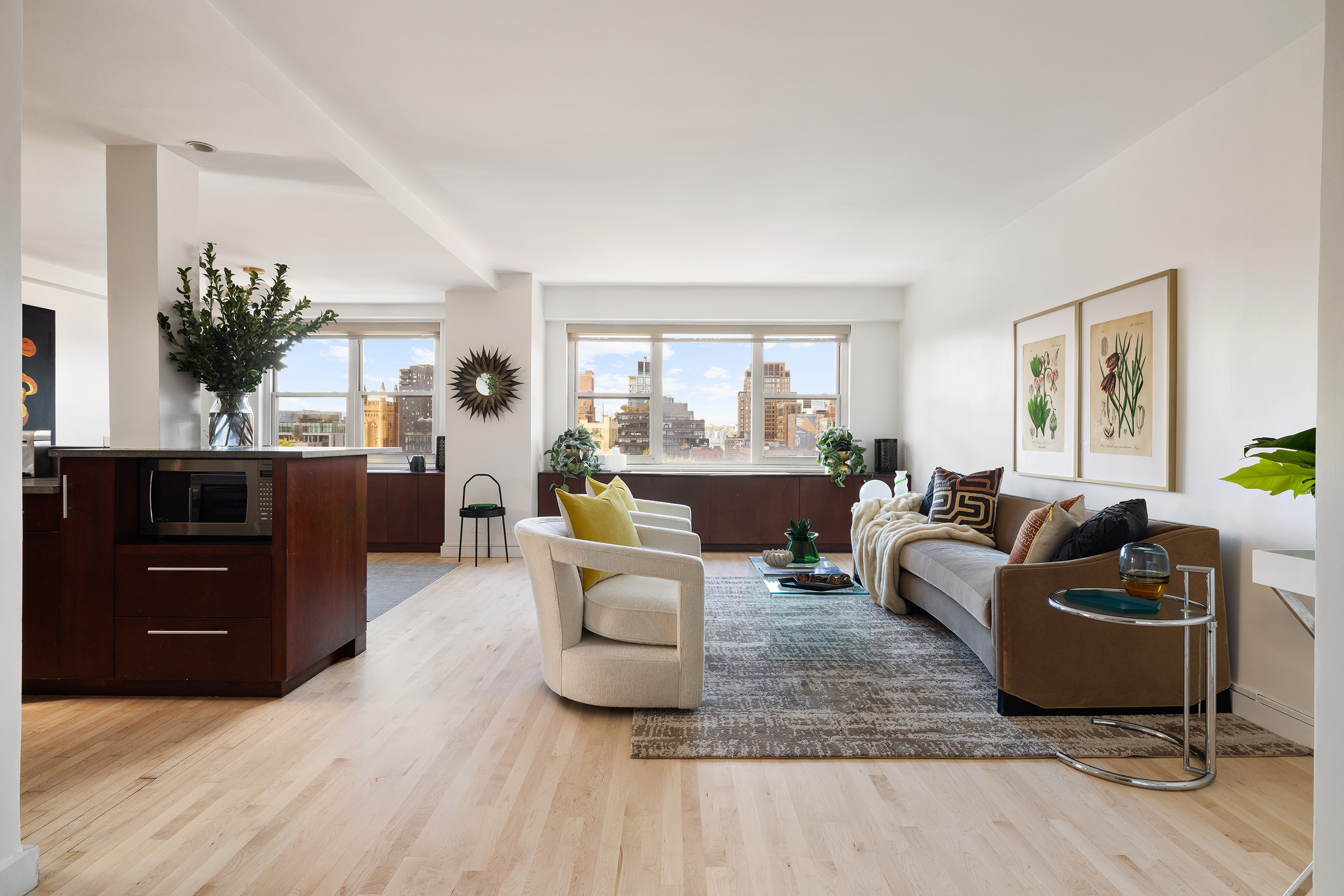 360 West 22nd Street, Unit 12B Manhattan, NY 10011 - Photo 2 of 16 a living room with furniture and a large window